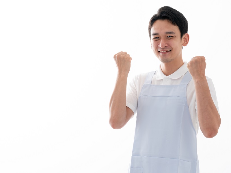 ガッツポーズをしている介護士のイメージ